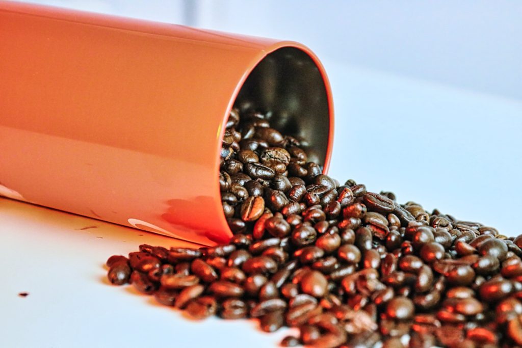 coffee beans spilled from container 